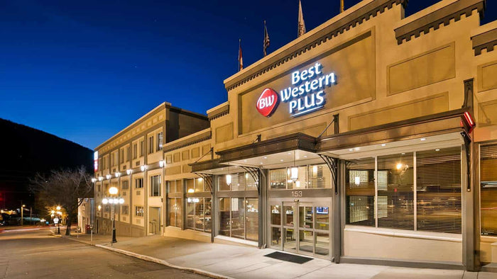 Best Western Plus hotel exterior in Nelson BC lit up at dusk