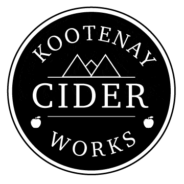 Kootenay Cider Works circular black and white logo with mountains, apples and CIDER WORKS text